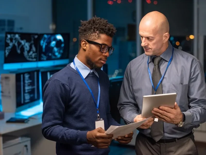 businessmen-discussing-data