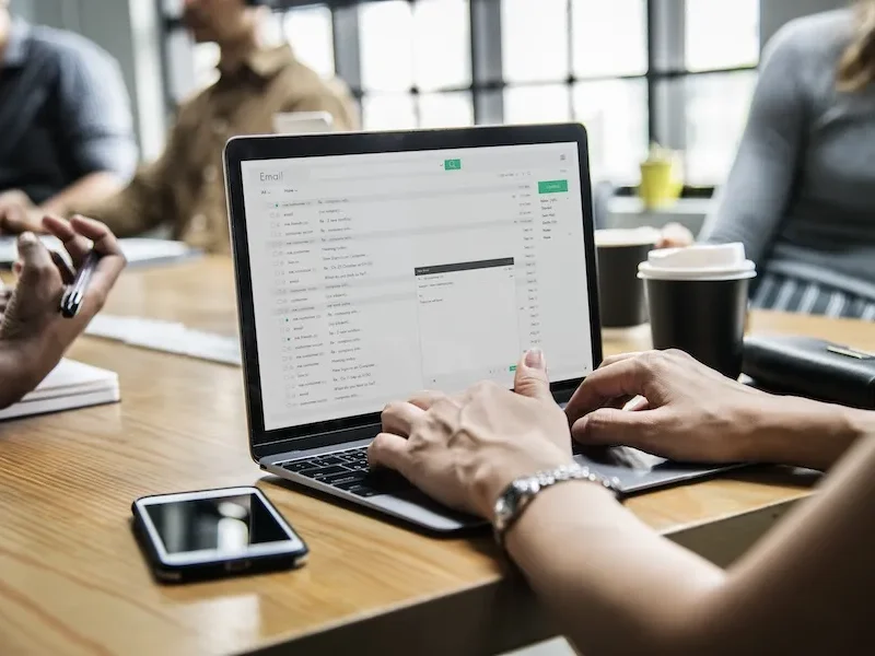 woman-checking-email-meeting